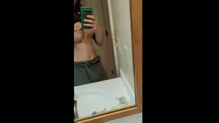 sprying a little milk at the mirror