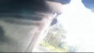 Freeballing in public, this twink walks outdoors commando, no underwear beneath his black Adidas tracksuit, Campus sneakers, while out cruising