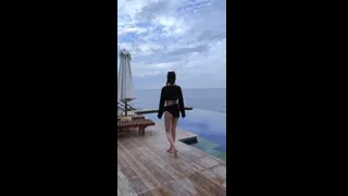 A collection of short videos of mermaid bikinis and black bikinis in the infinity pool
