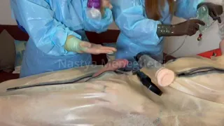 Mistress Nastya and Nurse Camille pump their patient's dick while he is in a body bag - Full ppe surgeon style