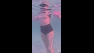 Amateur long legs perfect body girl's relaxing underwater swimming
