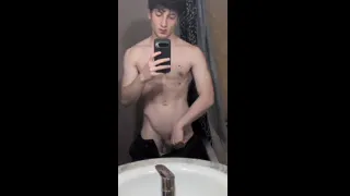 Young straight guy jerking in front of a mirror